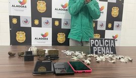 Homem é preso com três celulares e drogas tentando passar para reeducando