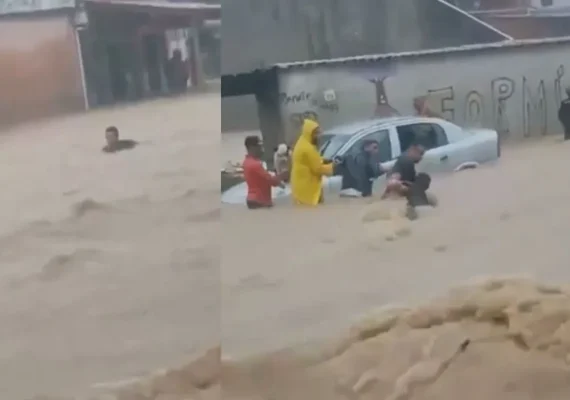 Homem é salvo por corrente humana após ser arrastado por enchente